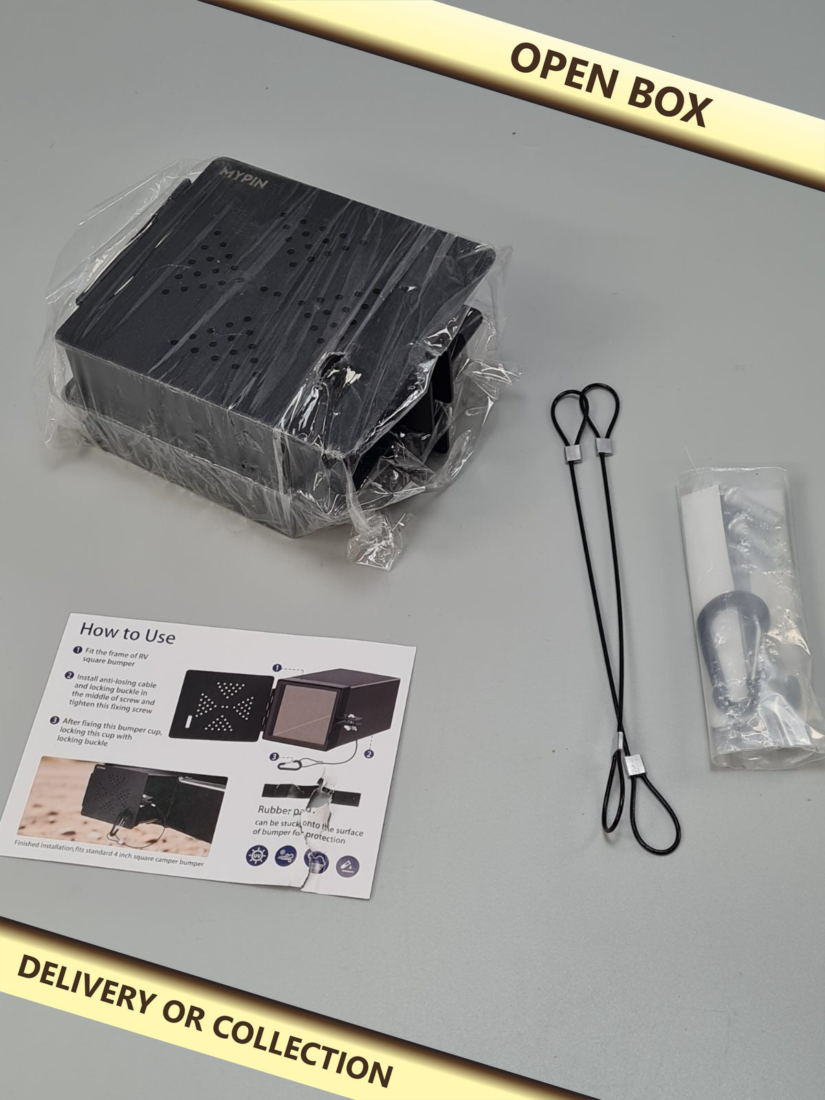 RV Bumper lockable end caps — photograph 1 — Open box; auction delivery information shown on image