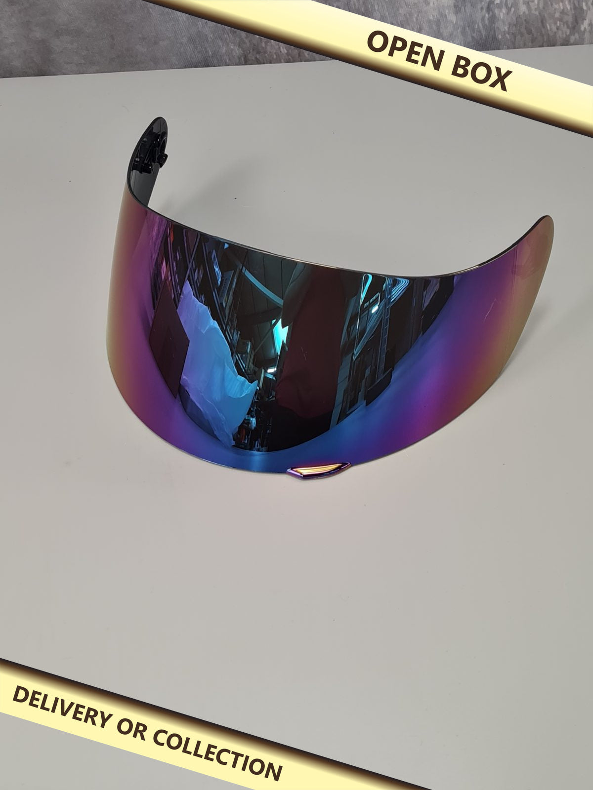 Motorcycle helmet visor — photograph 1 — Open box; auction delivery information shown on image