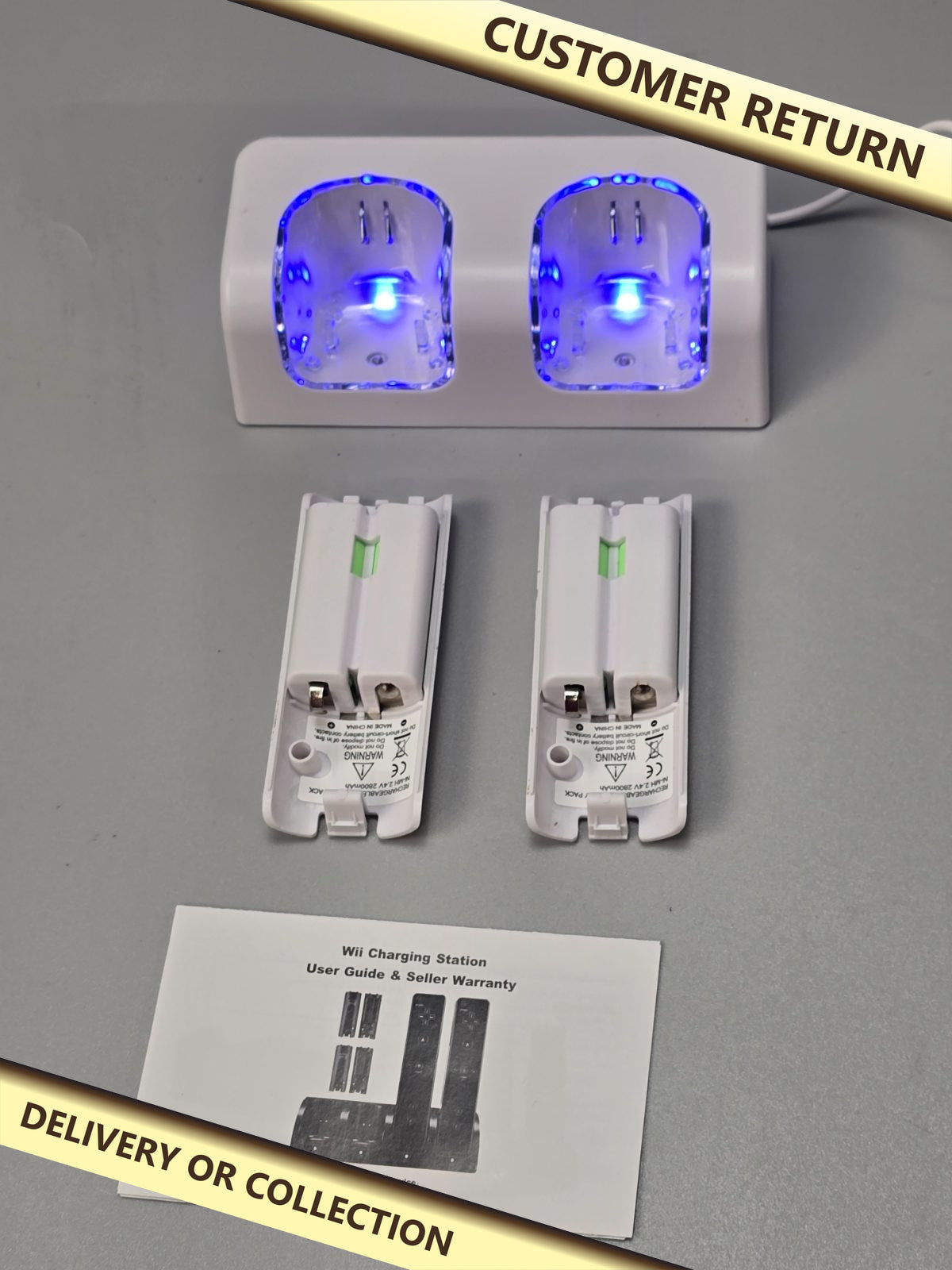 Wii Charging Station — photograph 1 — Customer return; auction delivery information shown on image