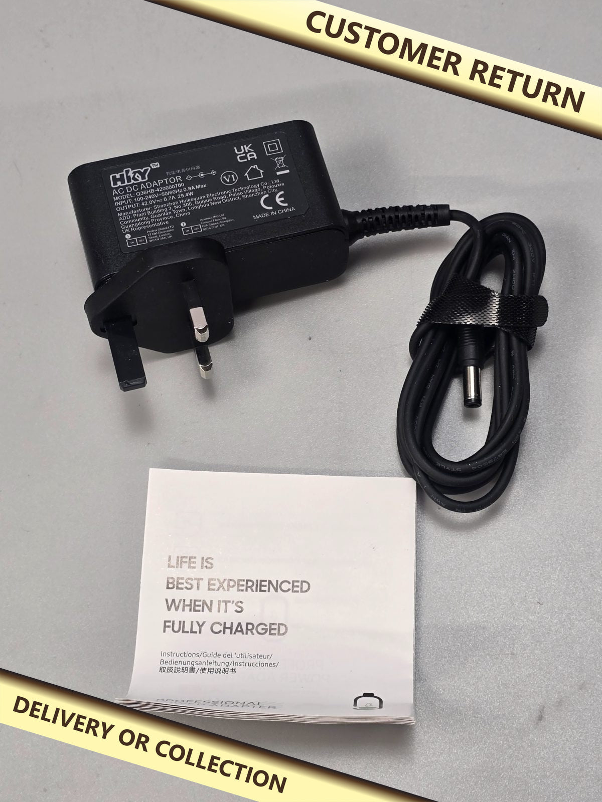 42v 0.7A 29.4w AC DC Power Supply — photograph 1 — Customer return; auction delivery information shown on image