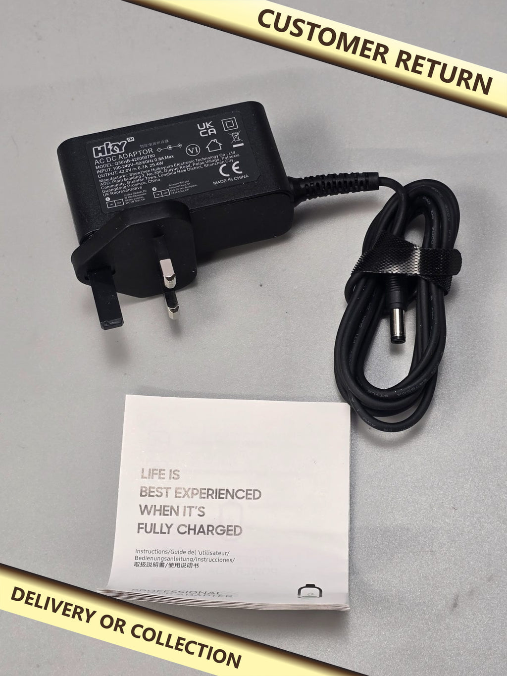 42v 0.7A 29.4w AC DC Power Supply — photograph 1 — Customer return; auction delivery information shown on image