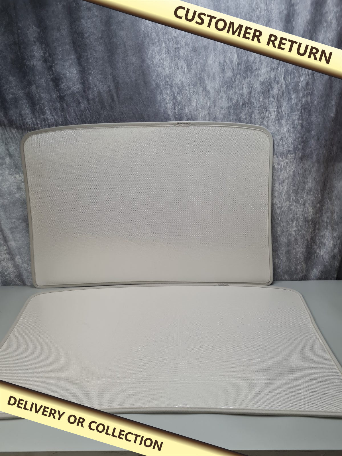 Tesla model Y sunshade — photograph 1 — Customer return; auction delivery information shown on image