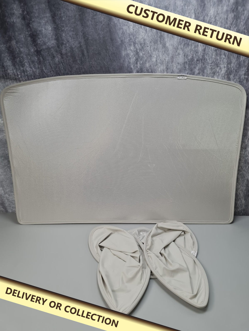 Tesla sunshade model 3/Y — photograph 1 — Customer return; auction delivery information shown on image