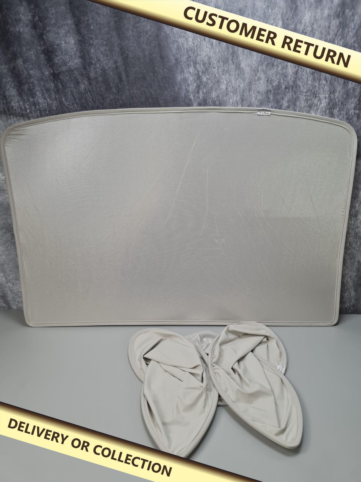 Tesla sunshade model 3/Y — photograph 1 — Customer return; auction delivery information shown on image
