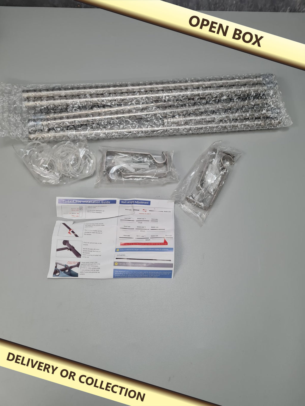 Curtain  rod 37- 52 inch set of 2 — photograph 1 — Open box; auction delivery information shown on image