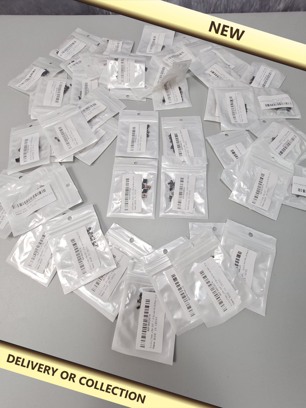 Packs of electronics switches — photograph 1 — New; auction delivery information shown on image