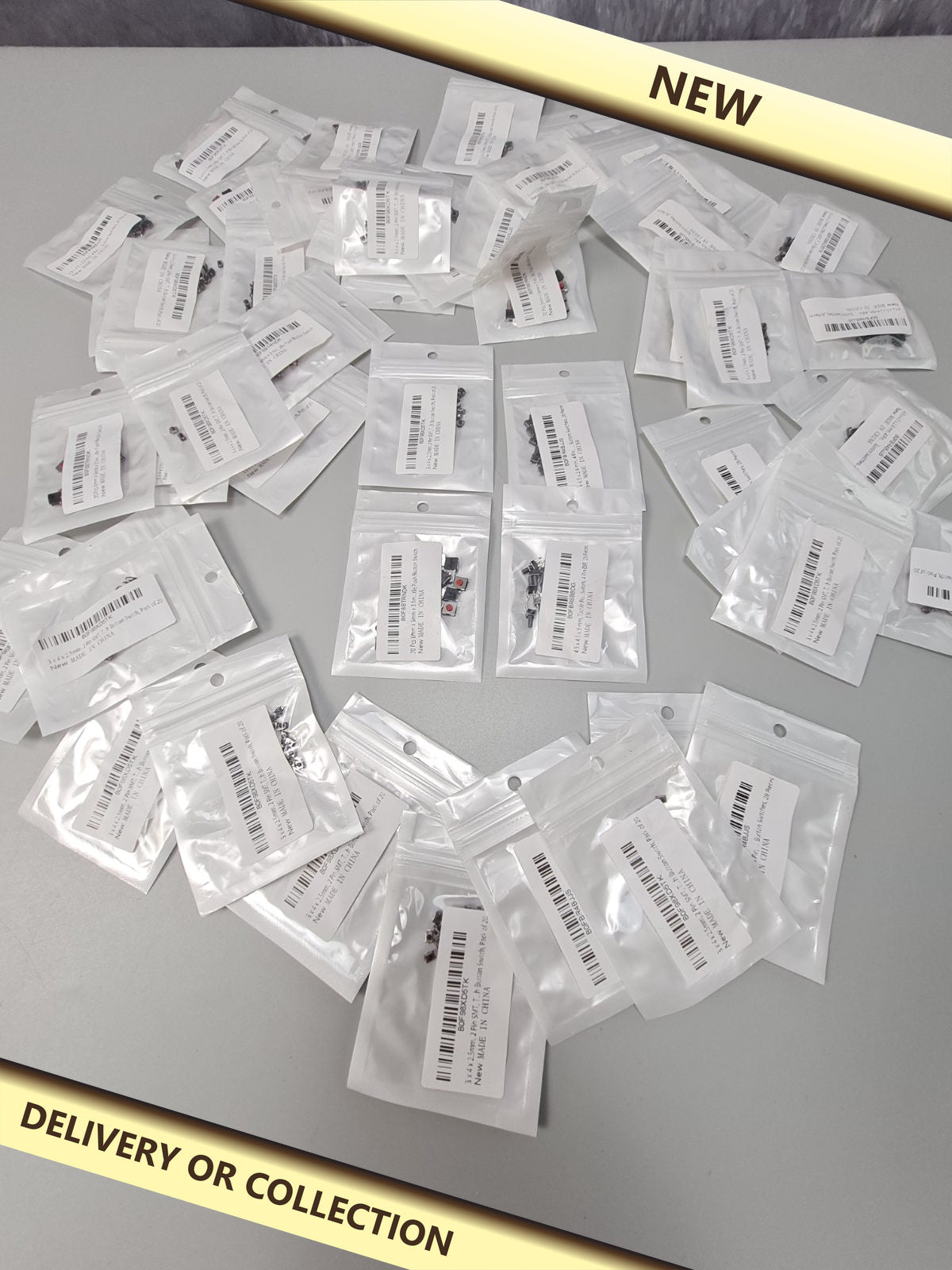 Packs of electronics switches — photograph 1 — New; auction delivery information shown on image