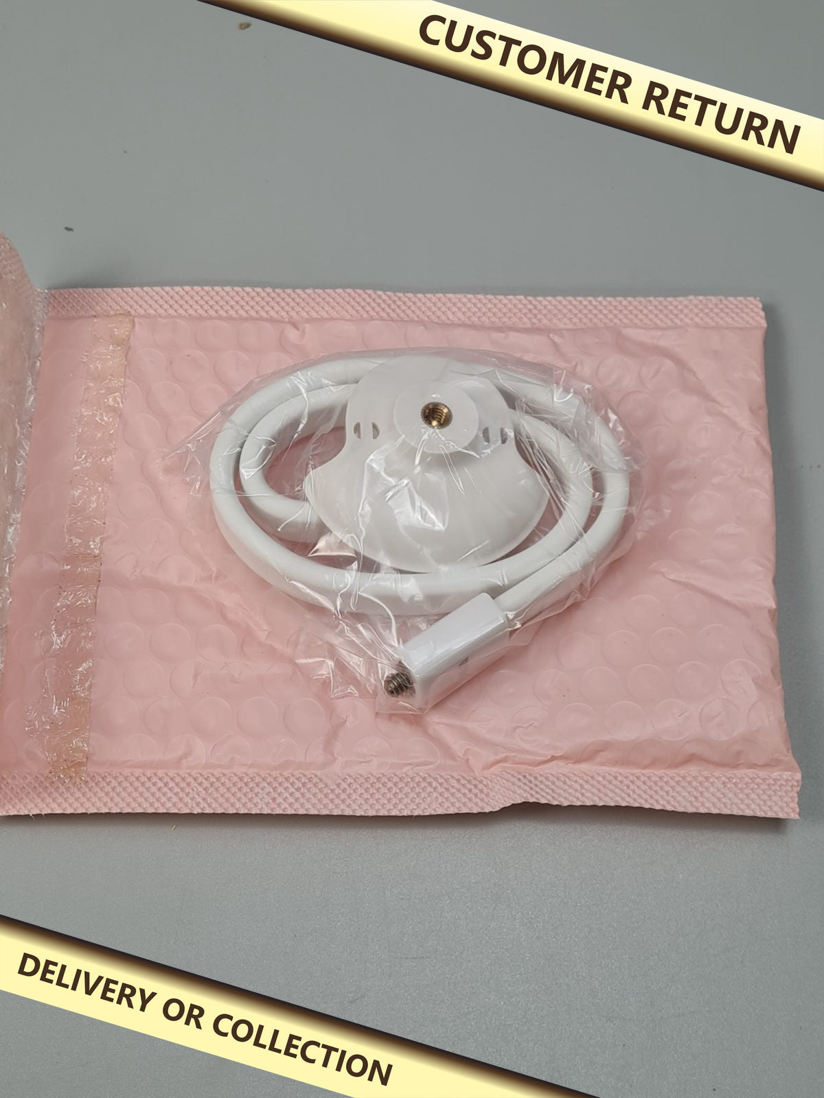 Baby monitor holder — photograph 1 — Customer return; auction delivery information shown on image