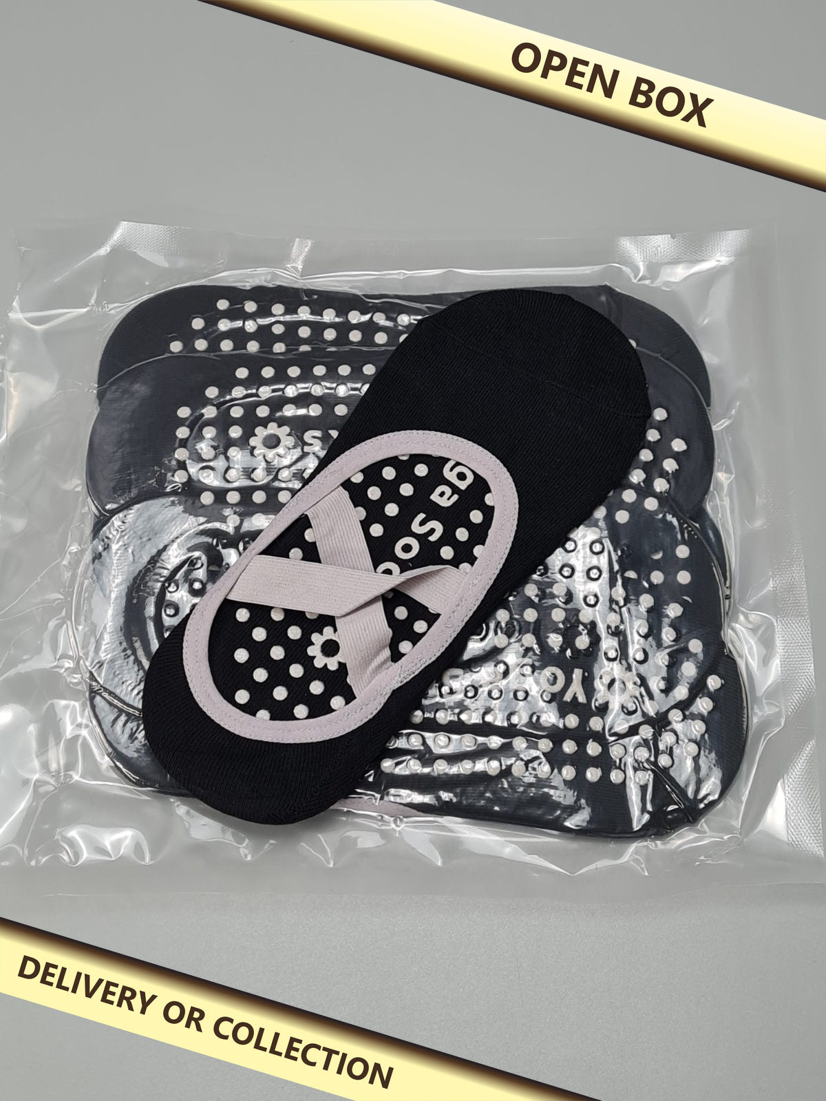 5 pairs of black yoga socks — photograph 1 — Open box; auction delivery information shown on image