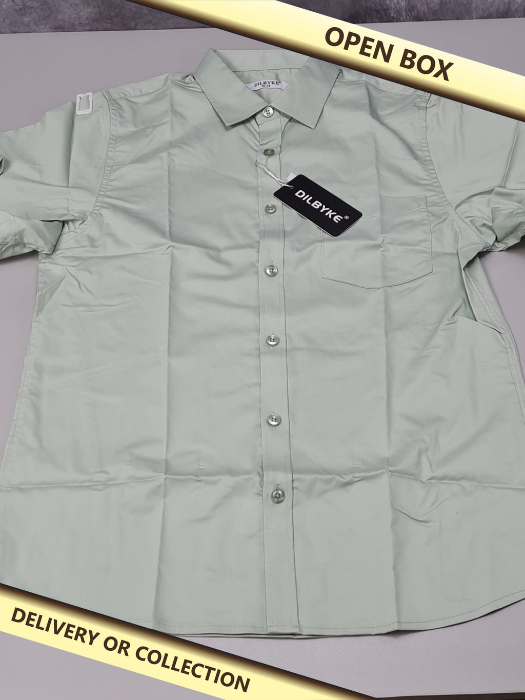 Green shirt age 13-14 years — photograph 1 — Open box; auction delivery information shown on image