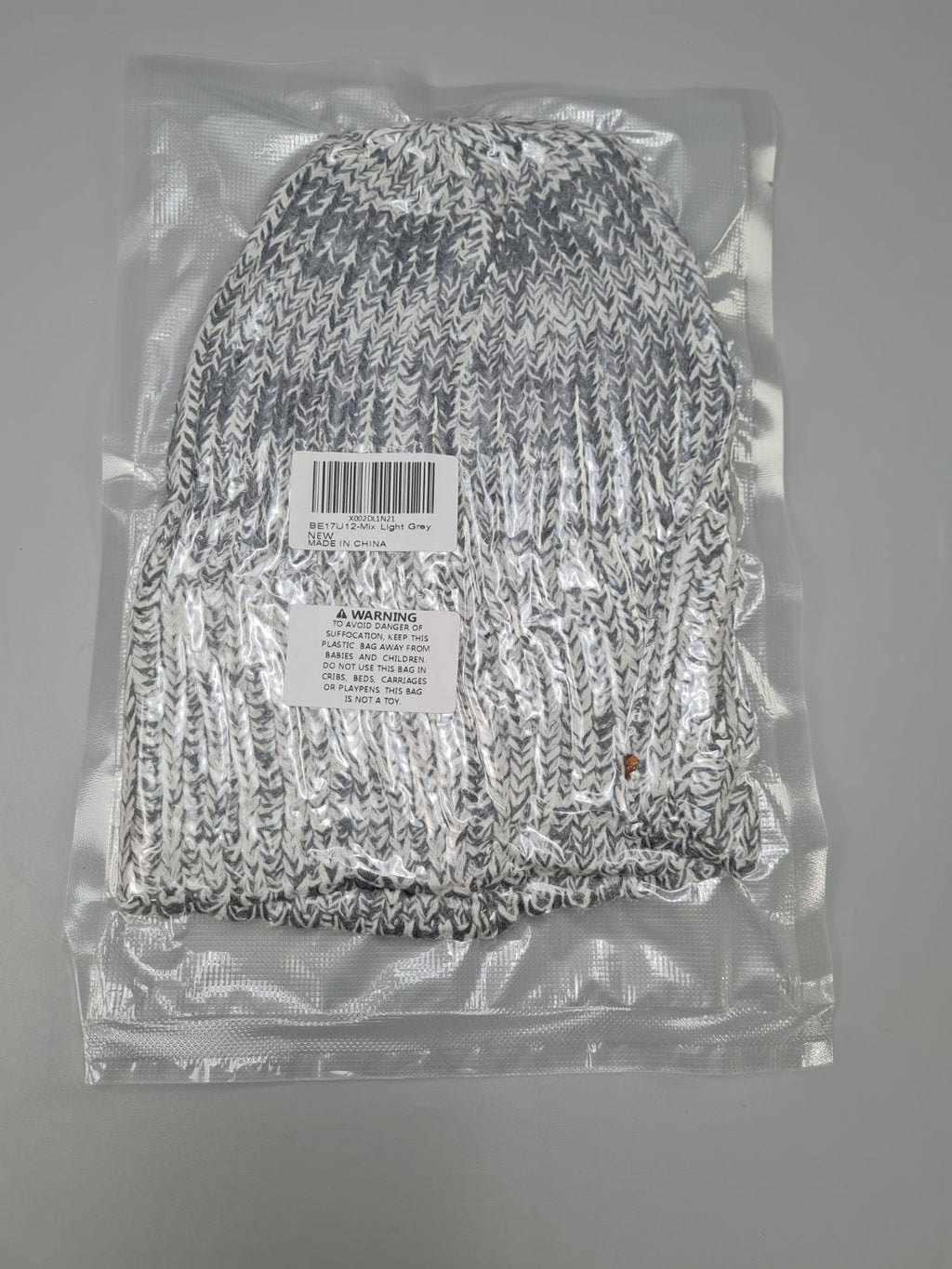 Light grey beanie hat — photograph 1