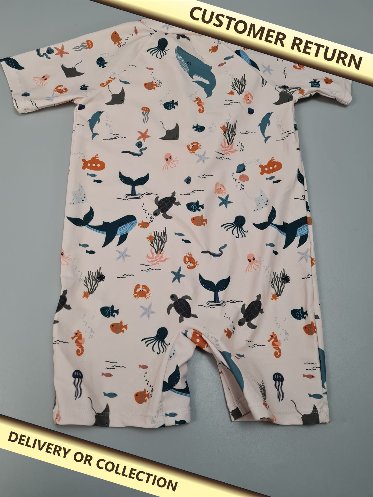 Baby all in one swimming costume — photograph 1 — Customer return; auction delivery information shown on image
