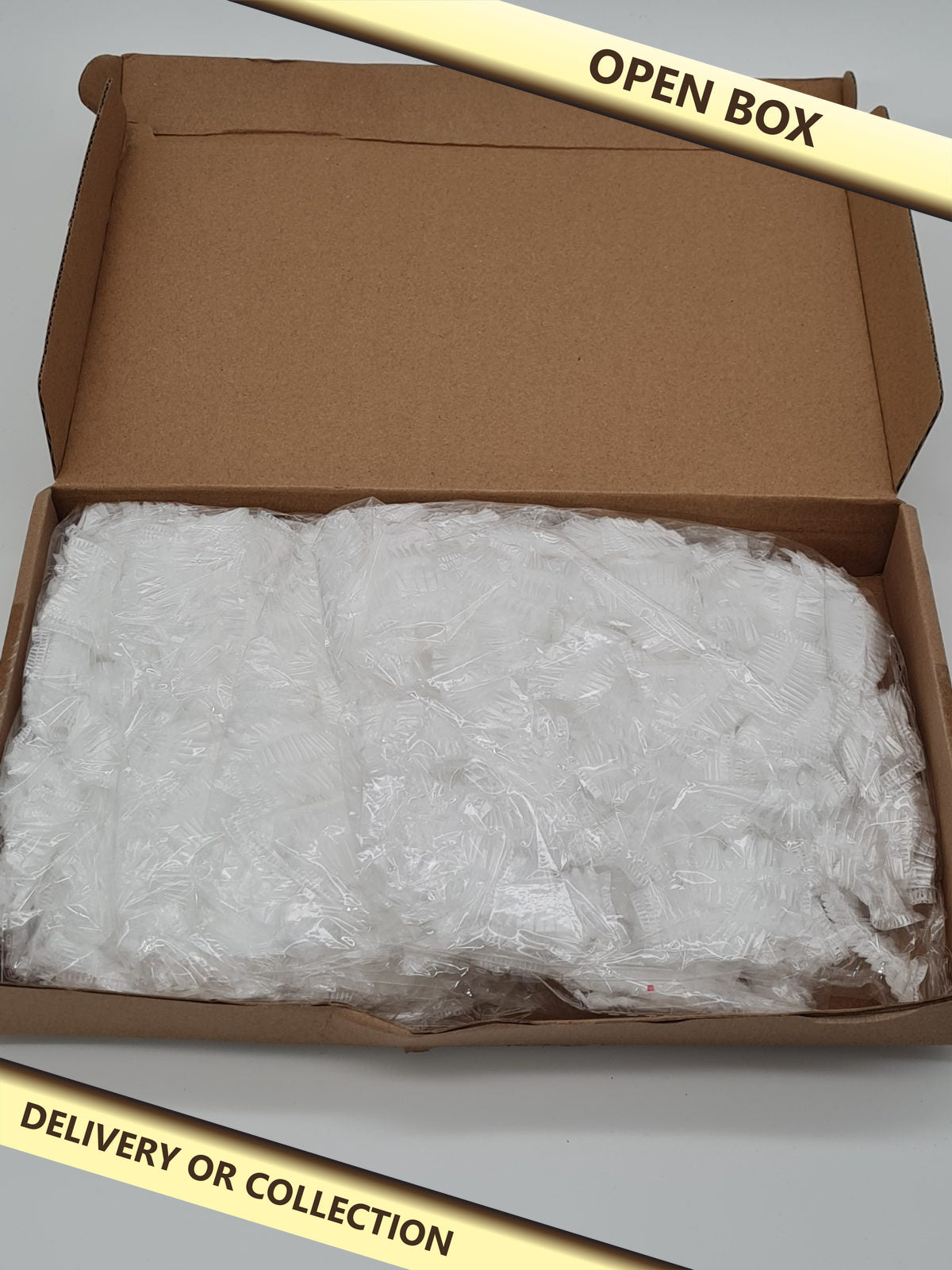 Pack of 100 Deposable ear covers — photograph 1 — Open box; auction delivery information shown on image