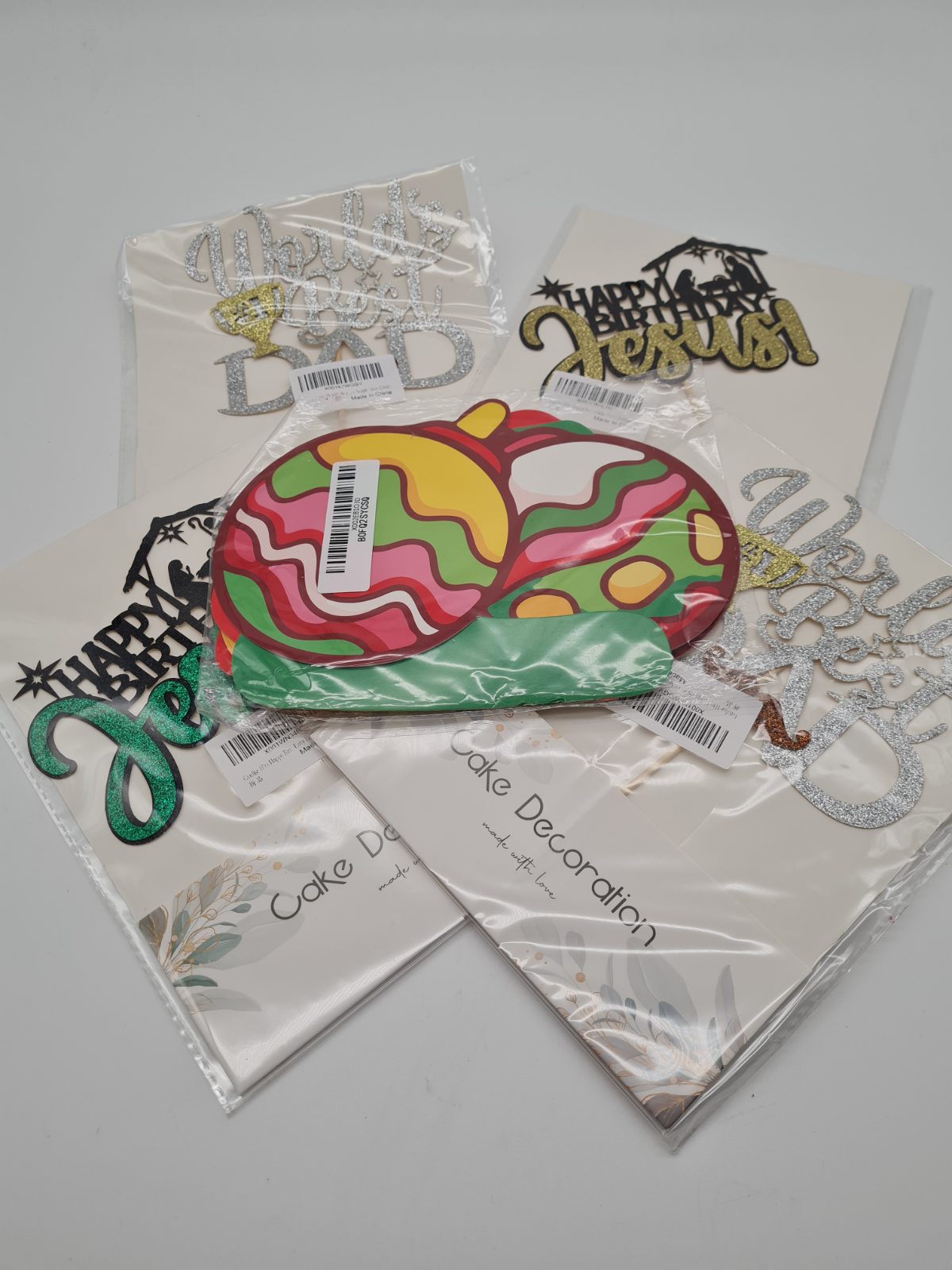 5 packs of a variety of cake toppers — photograph 1