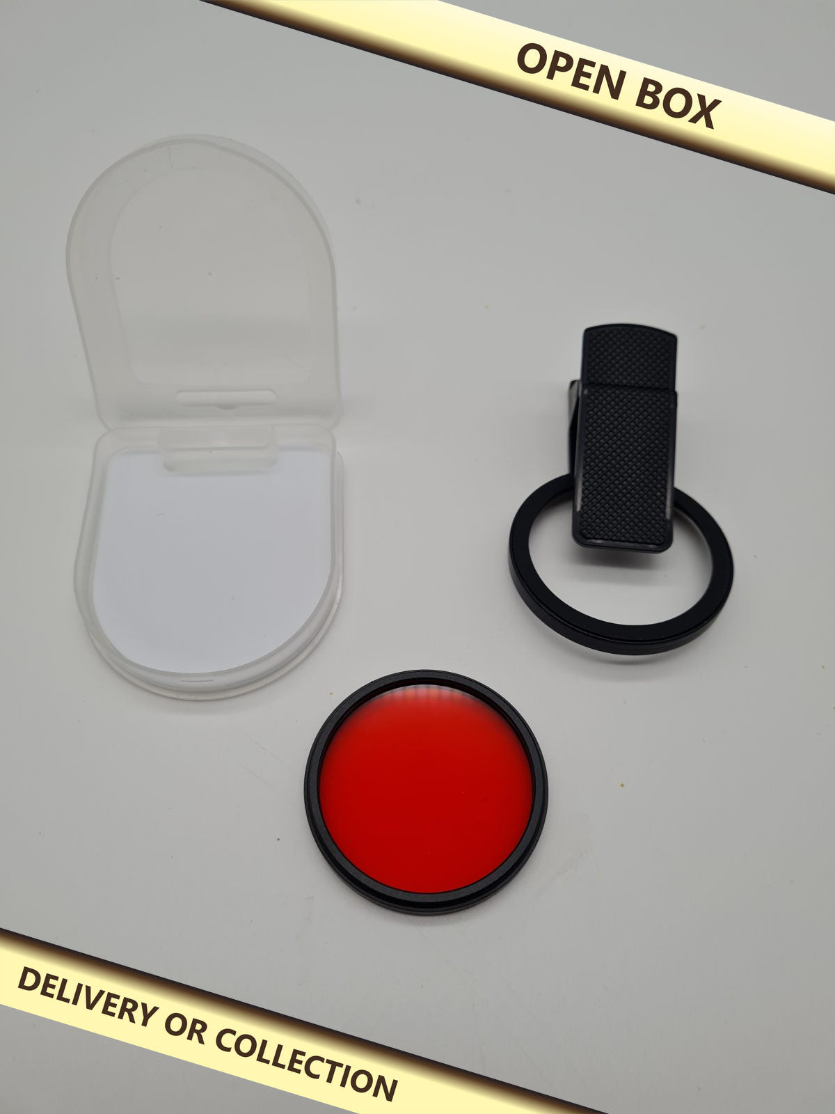 52mm Orange Camera Lens Filter with Clip Mount — photograph 1 — Open box; auction delivery information shown on image