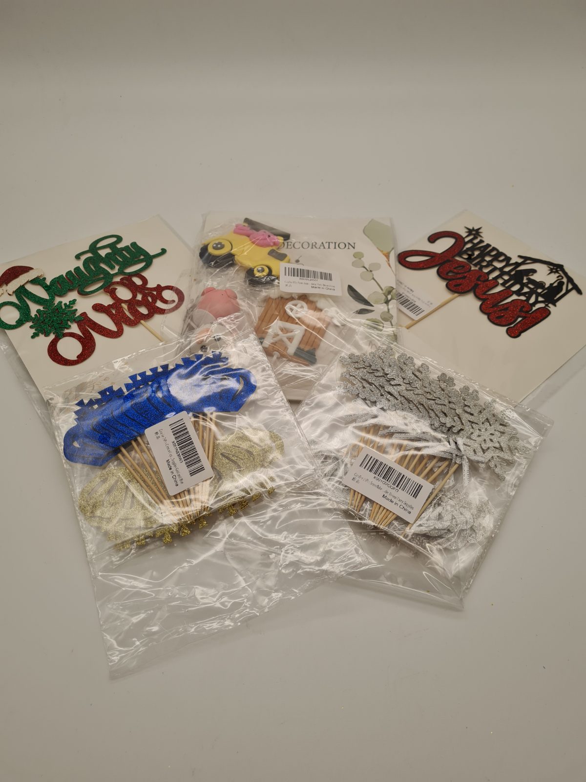 5 packs of different cake toppers — photograph 1