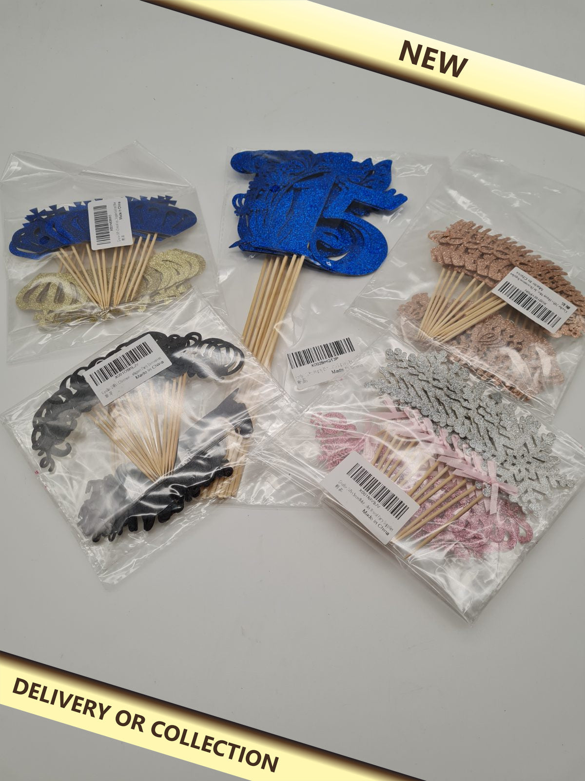 5 packs of cake toppers — photograph 1 — New; auction delivery information shown on image