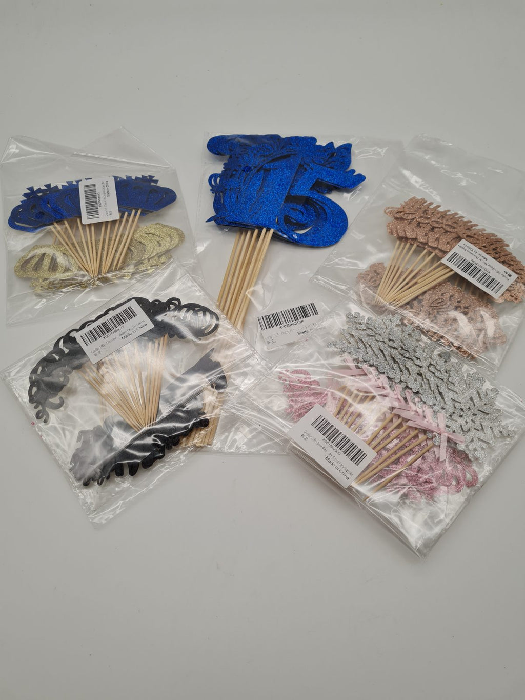 5 packs of cake toppers — photograph 1