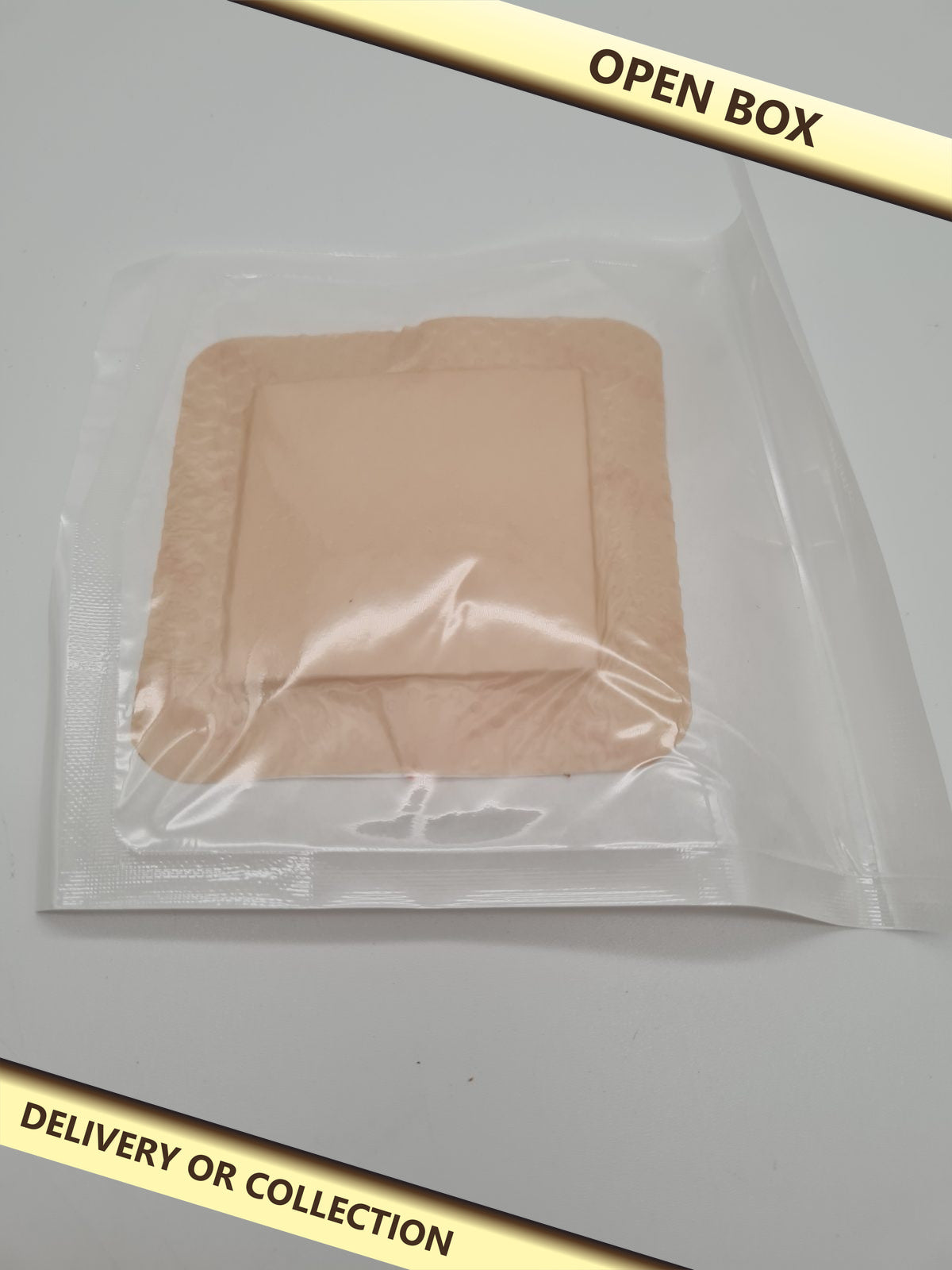 15 pack of Disposable adhesive cover patches — photograph 1 — Open box; auction delivery information shown on image