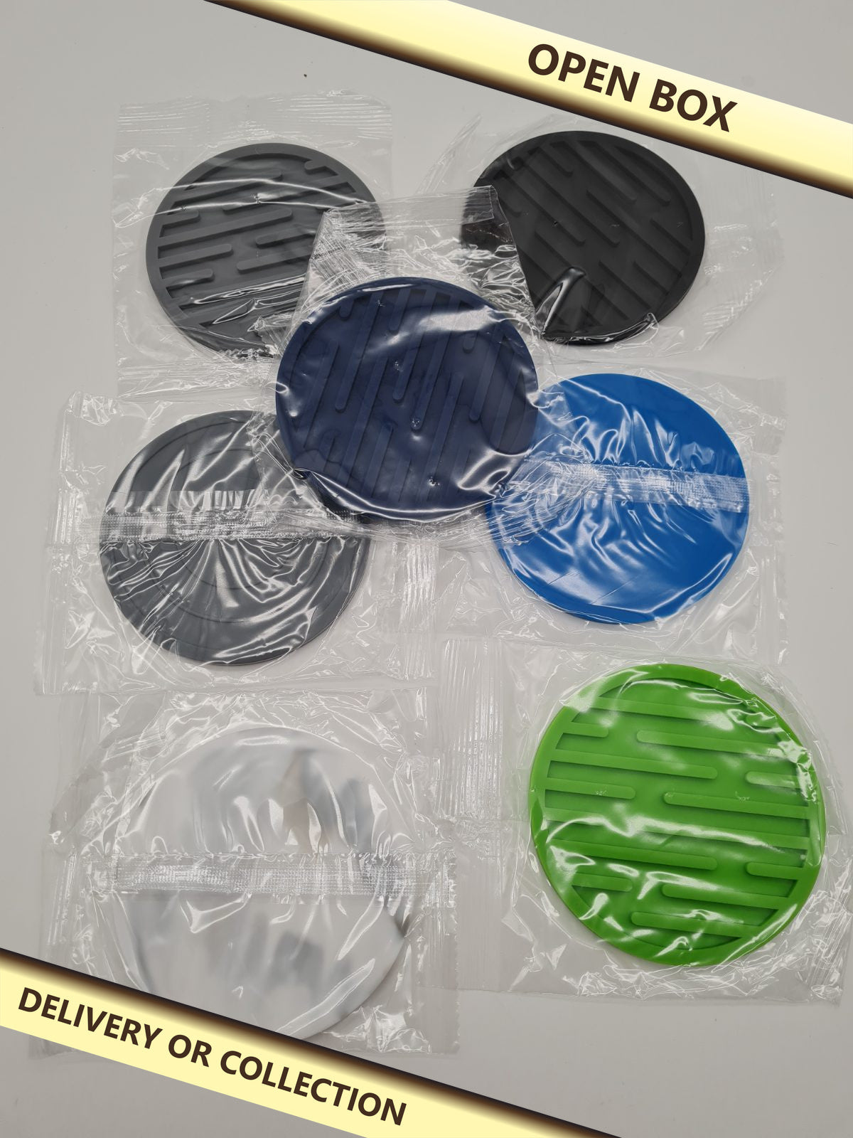 Set of 7 Round Silicone Drinks Coasters — photograph 1 — Open box; auction delivery information shown on image