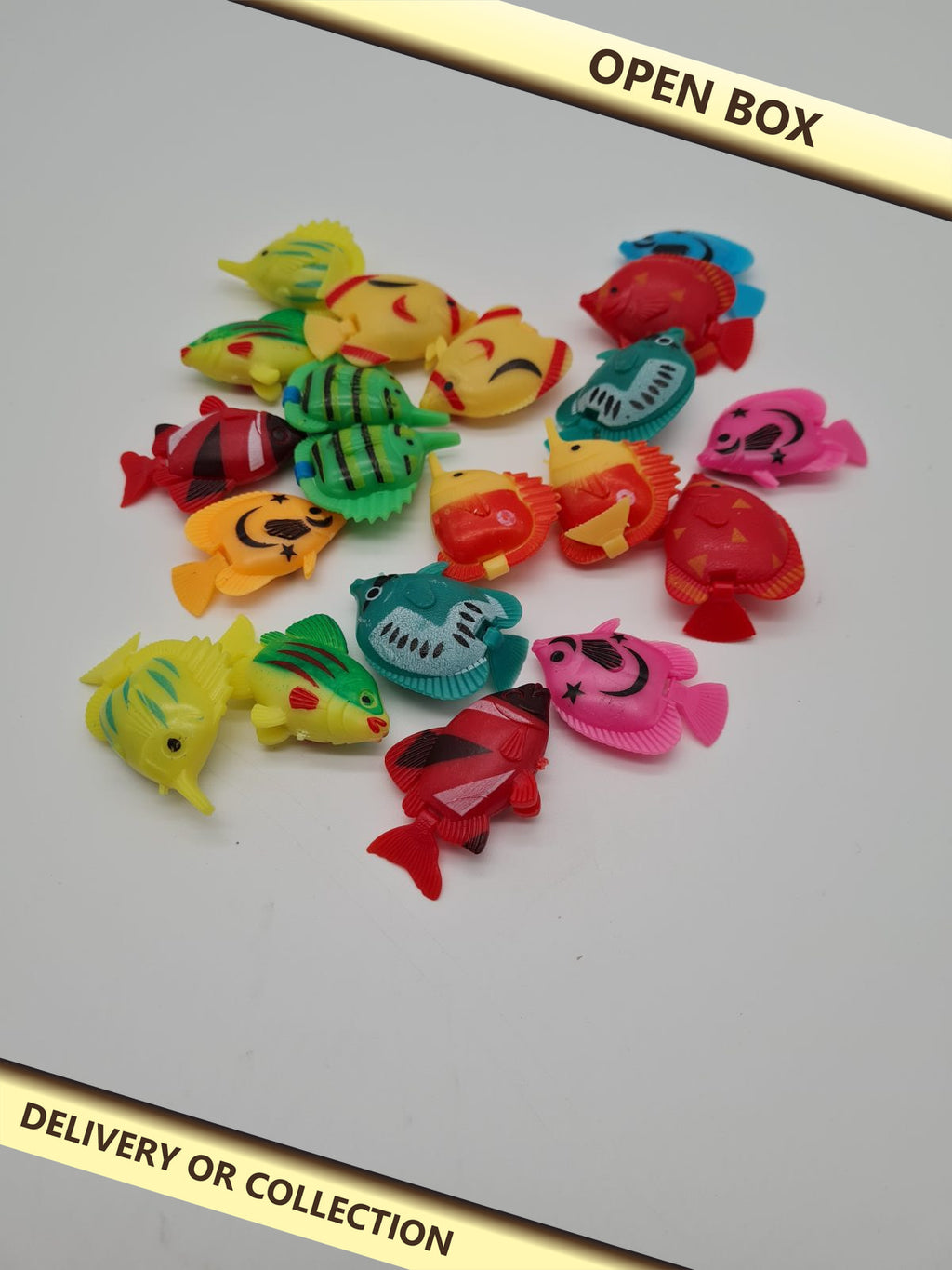Artificial Floating Fish Aquarium Decorations – Set of 20 — photograph 1 — Open box; auction delivery information shown on image