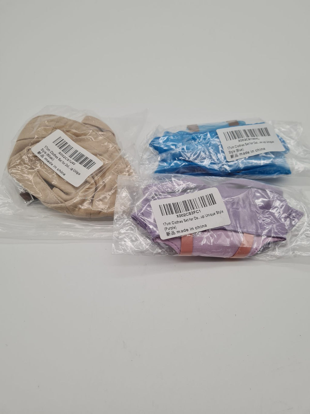 3 packs of clothes for dolls — photograph 1