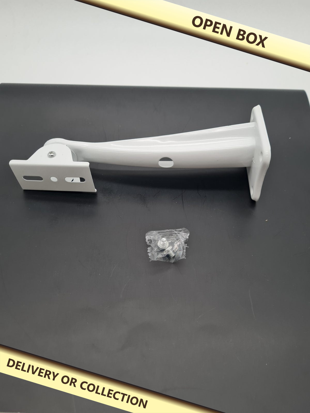 Adjustable Wall or Ceiling Mounting Bracket — photograph 1 — Open box; auction delivery information shown on image