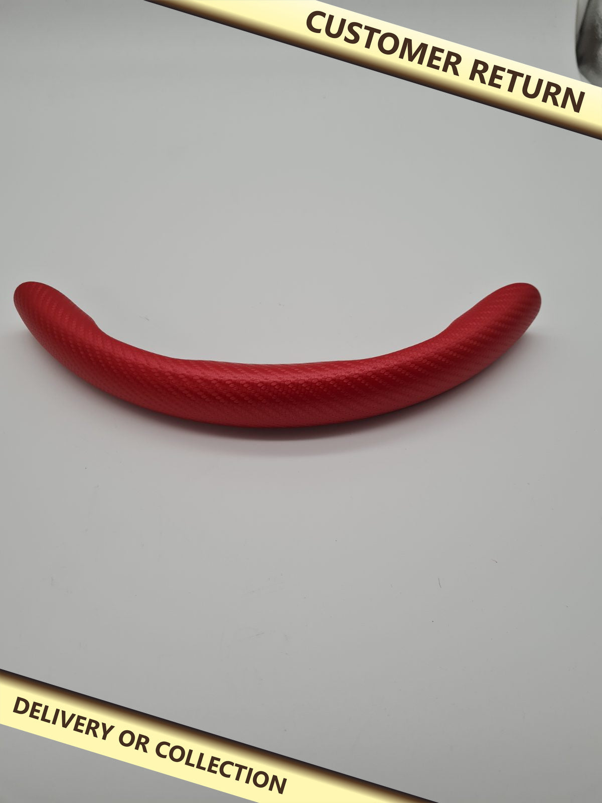 Partial Steering Wheel Grip Cover — photograph 1 — Customer return; auction delivery information shown on image