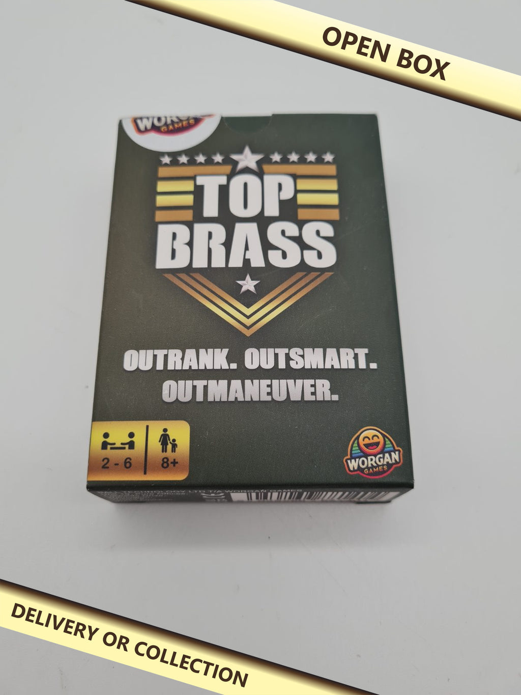 Top Brass Card Game — photograph 1 — Open box; auction delivery information shown on image