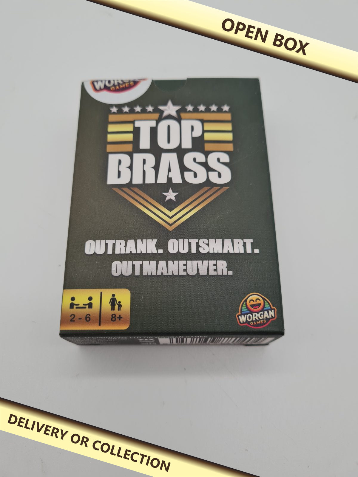 Top Brass Card Game — photograph 1 — Open box; auction delivery information shown on image