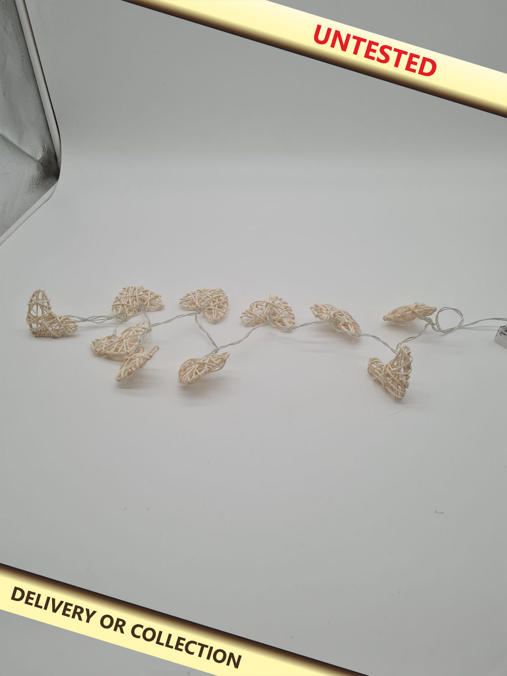 Woven Heart Battery-Powered String Lights — photograph 1 — Untested; auction delivery information shown on image