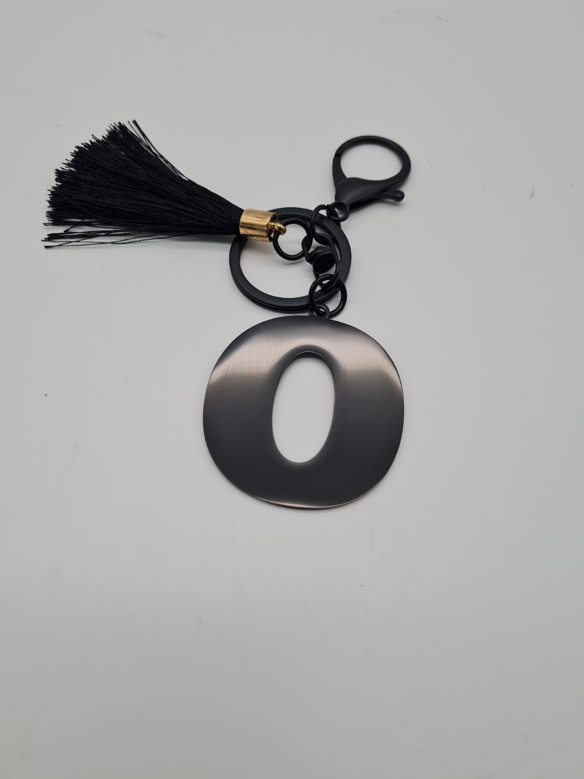 Letter O Initial Keyring with Tassel — photograph 1