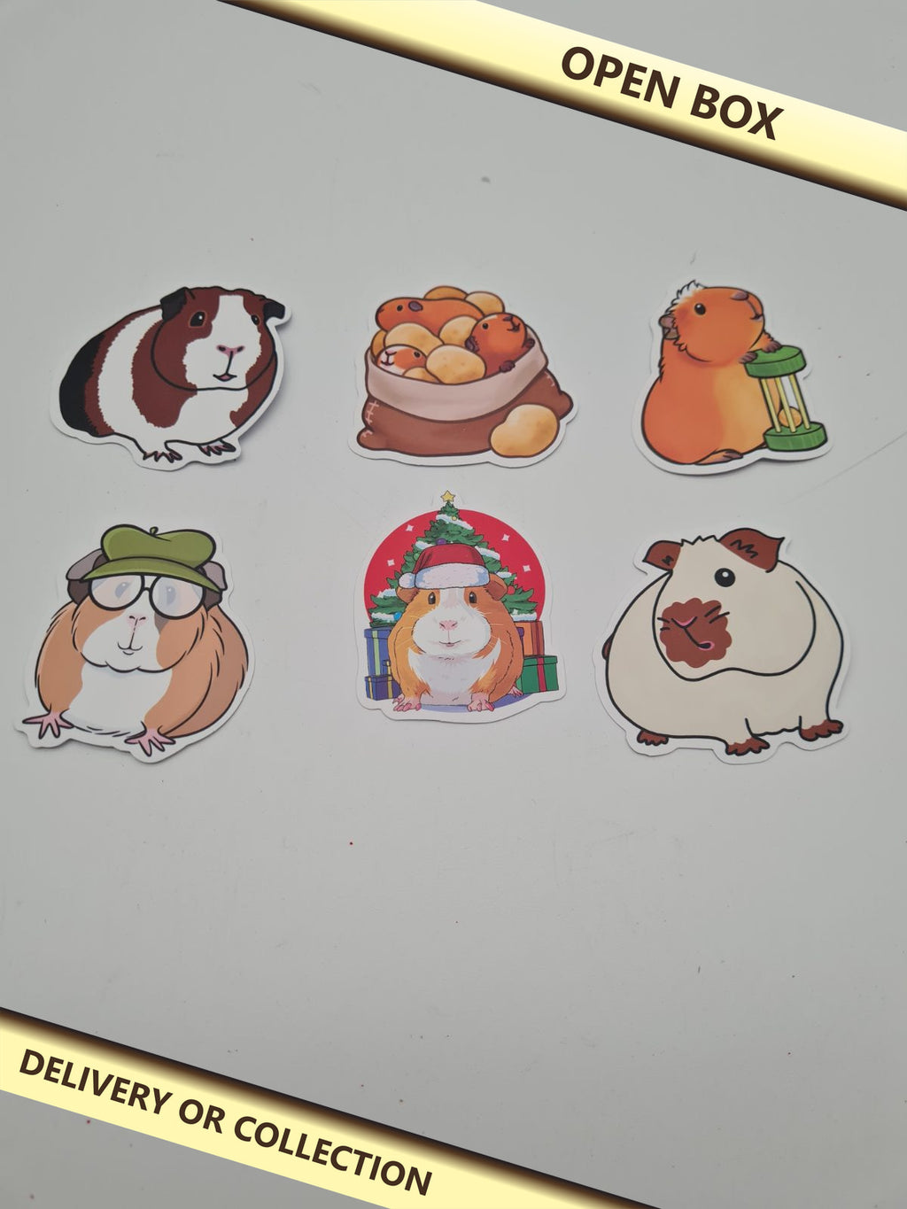 Waterproof stickers — photograph 1 — Open box; auction delivery information shown on image