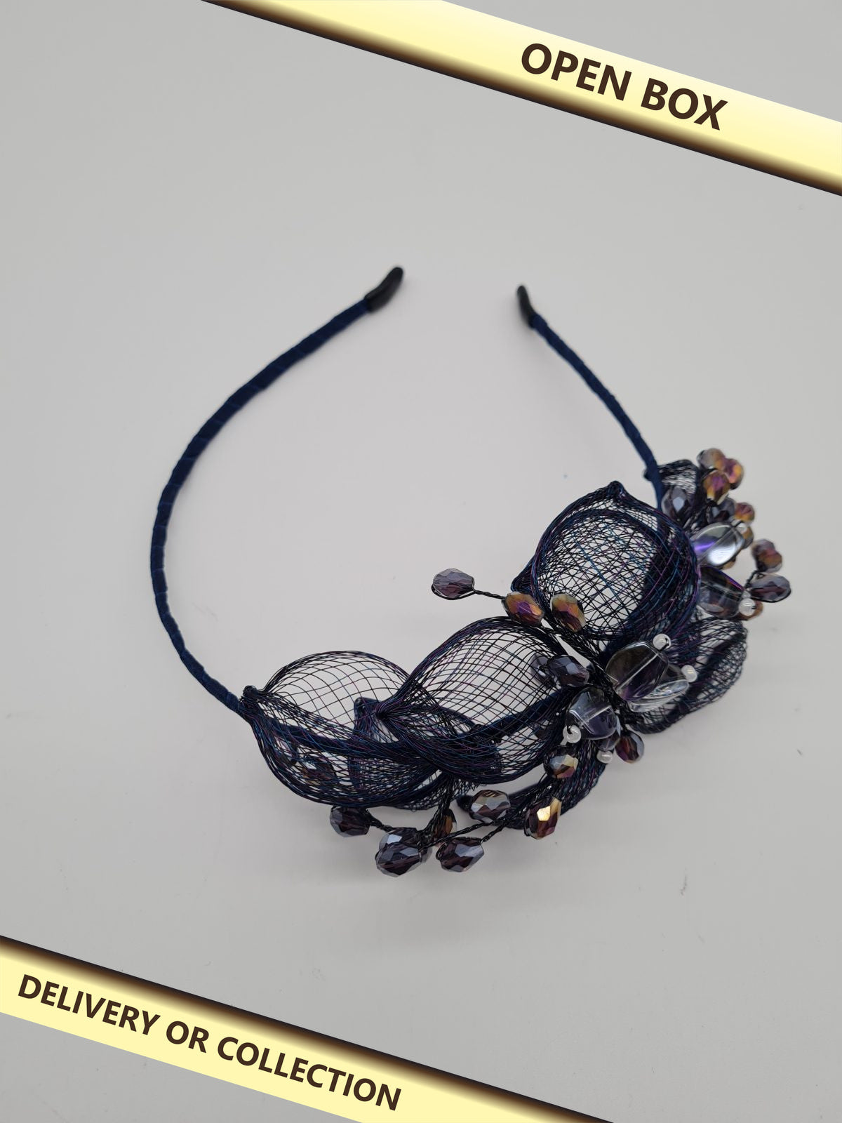 Decorative beaded floral headband — photograph 1 — Open box; auction delivery information shown on image
