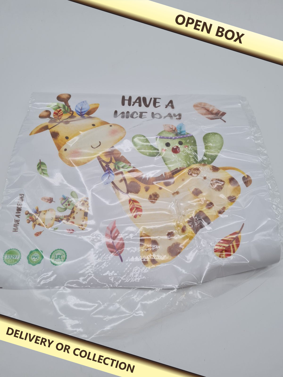 Children's Giraffe and Cactus Wall Sticker — photograph 1 — Open box; auction delivery information shown on image