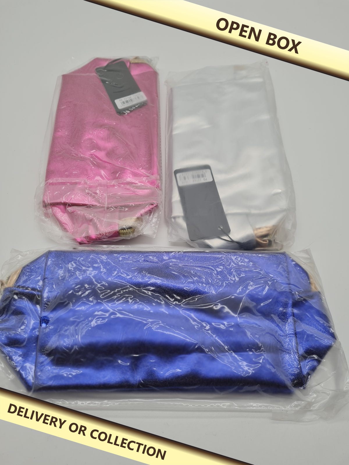 3 pack ofMetallic zip cosmetic bag — photograph 1 — Open box; auction delivery information shown on image