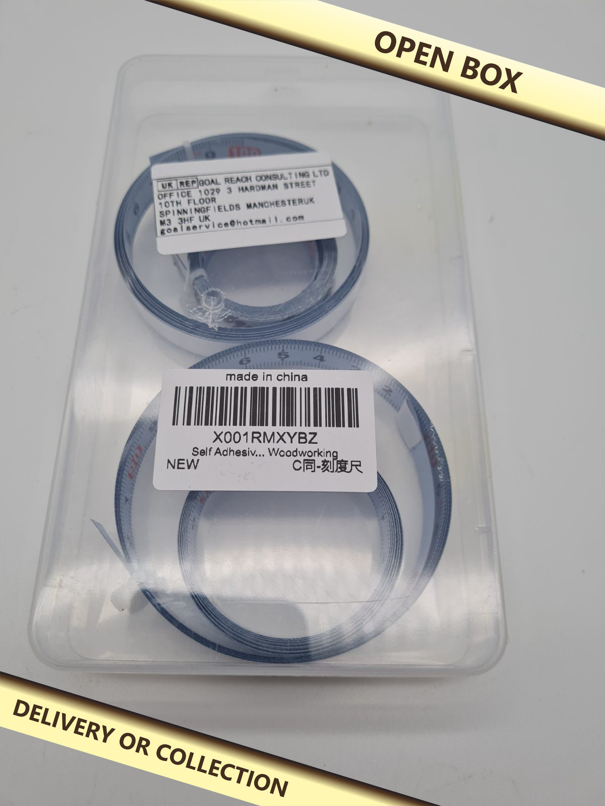 Set of 4 Self-Adhesive Metric Measuring Tape Strips — photograph 1 — Open box; auction delivery information shown on image