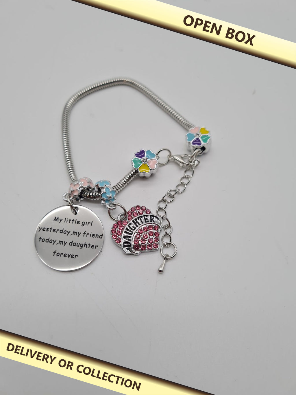 Daughter-Themed Charm Bracelet — photograph 1 — Open box; auction delivery information shown on image
