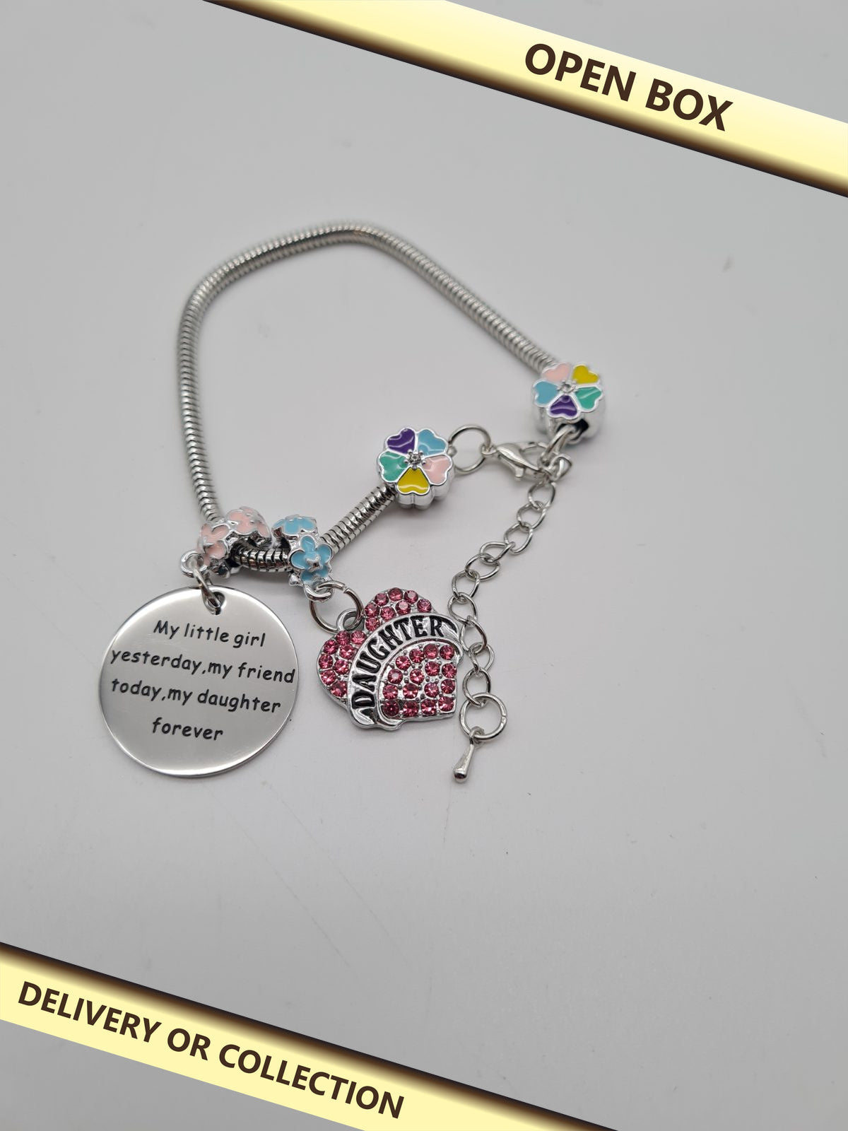Daughter-Themed Charm Bracelet — photograph 1 — Open box; auction delivery information shown on image