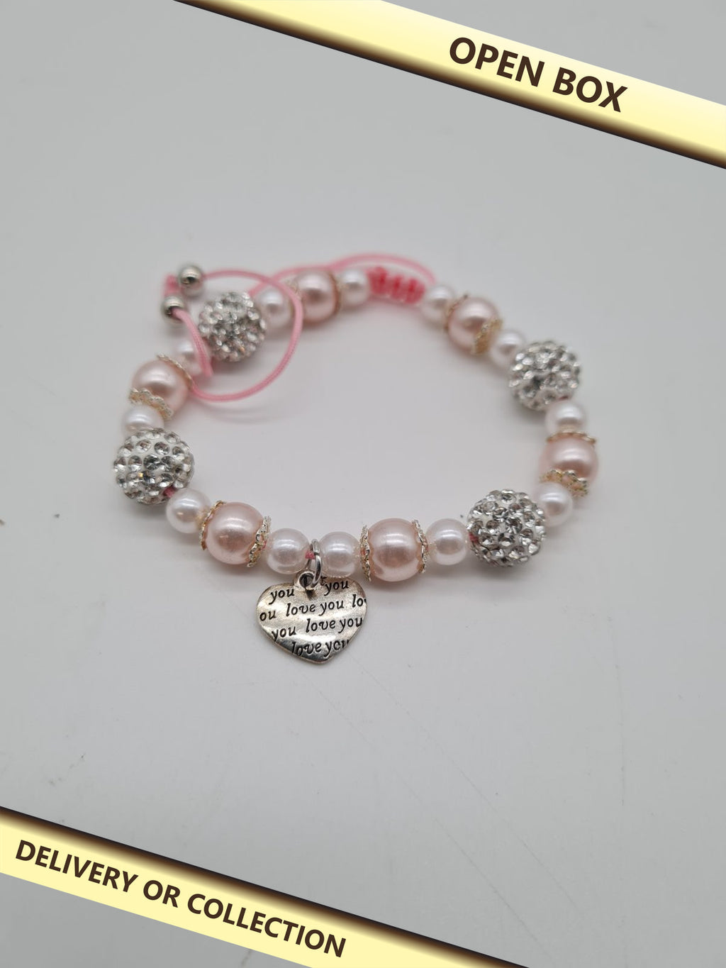 Girls' Beaded Heart Charm Bracelet — photograph 1 — Open box; auction delivery information shown on image
