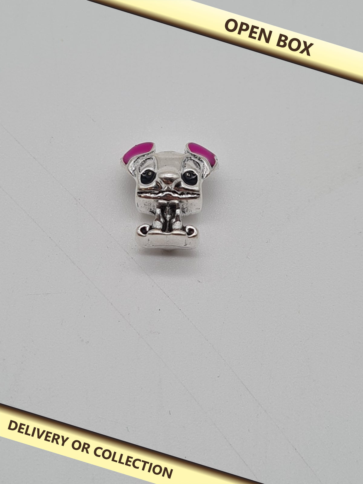 Stitch Character Bracelet Charm — photograph 1 — Open box; auction delivery information shown on image
