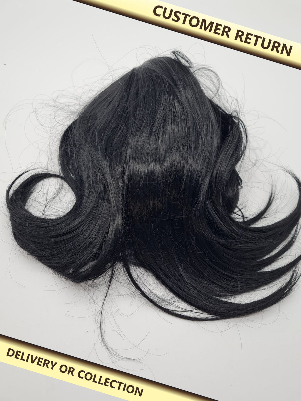 Short black curled hair piece — photograph 1 — Customer return; auction delivery information shown on image