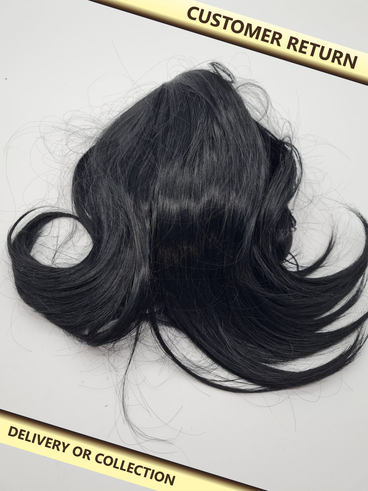 Short black curled hair piece — photograph 1 — Customer return; auction delivery information shown on image