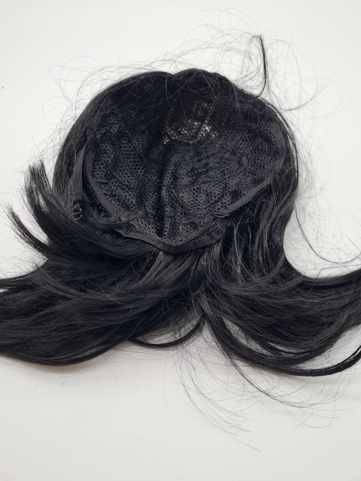 Short black curled hair piece — photograph 2