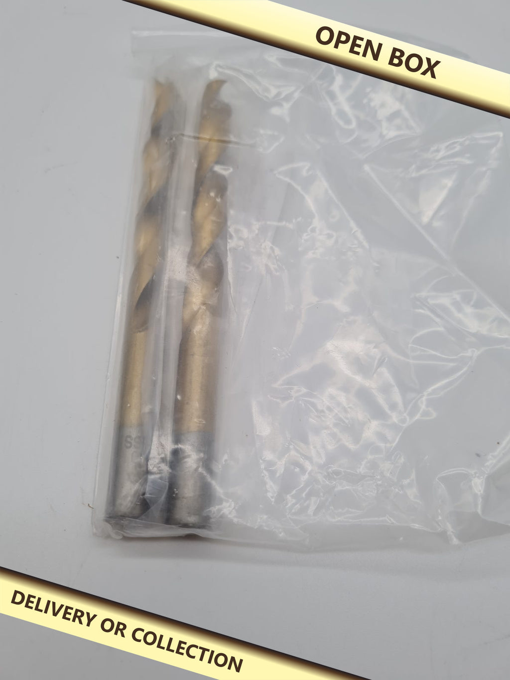 2-Piece Brad Point Drill Bit Set — photograph 1 — Open box; auction delivery information shown on image