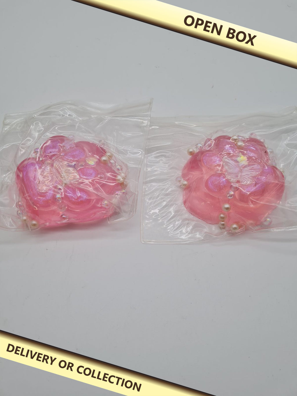 2 pcs cat paw squeeze toys — photograph 1 — Open box; auction delivery information shown on image