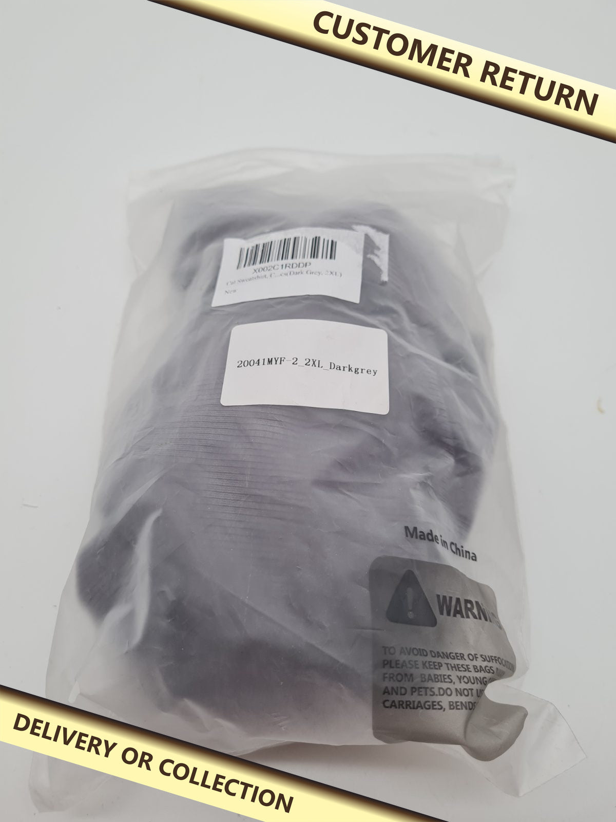 Cat sweatshirt — photograph 1 — Customer return; auction delivery information shown on image