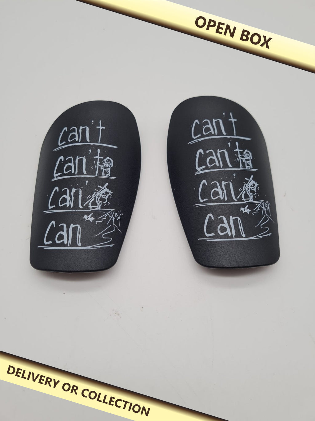 Pair of Motorcycle Knee Sliders — photograph 1 — Open box; auction delivery information shown on image