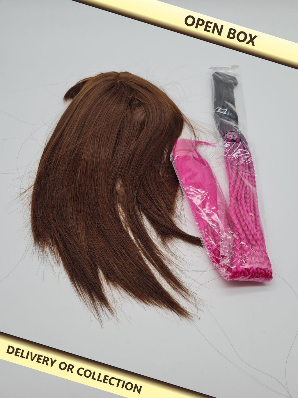 Wig and braided hair extension set — photograph 1 — Open box; auction delivery information shown on image