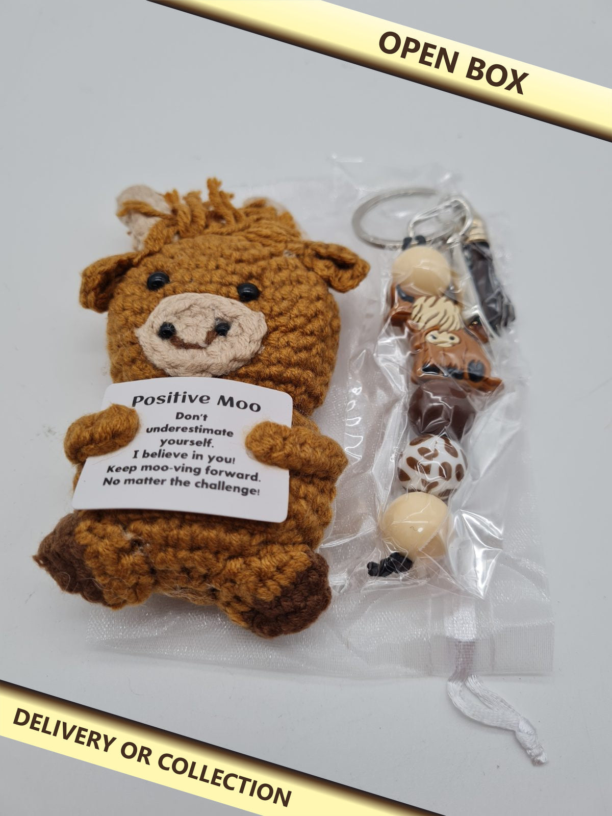Positive Moo Cow Plush Toy and Keyring Set — photograph 1 — Open box; auction delivery information shown on image